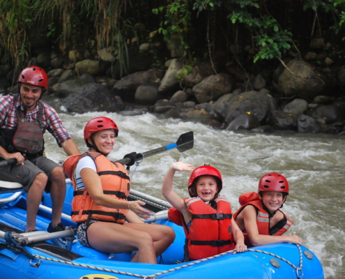 A Family Enjoying River Rafting