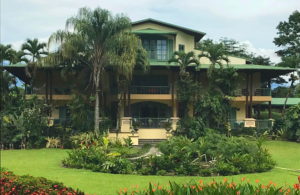 A long shot of the hotel and the lawn