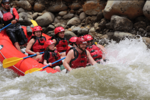 A close-up shot of the people enjoying river rafting